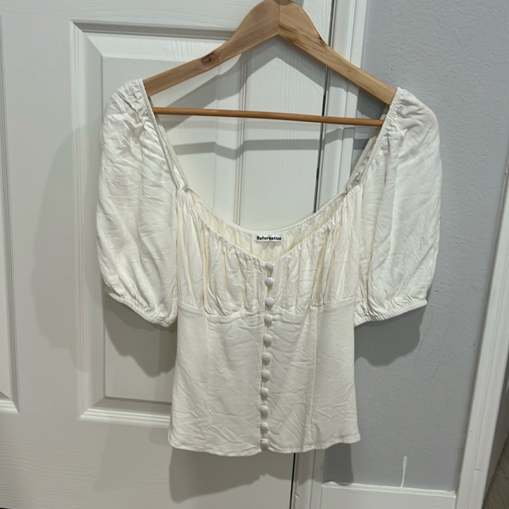 Reformation white puff sleeve blouse. Brand new condition, zipper on side